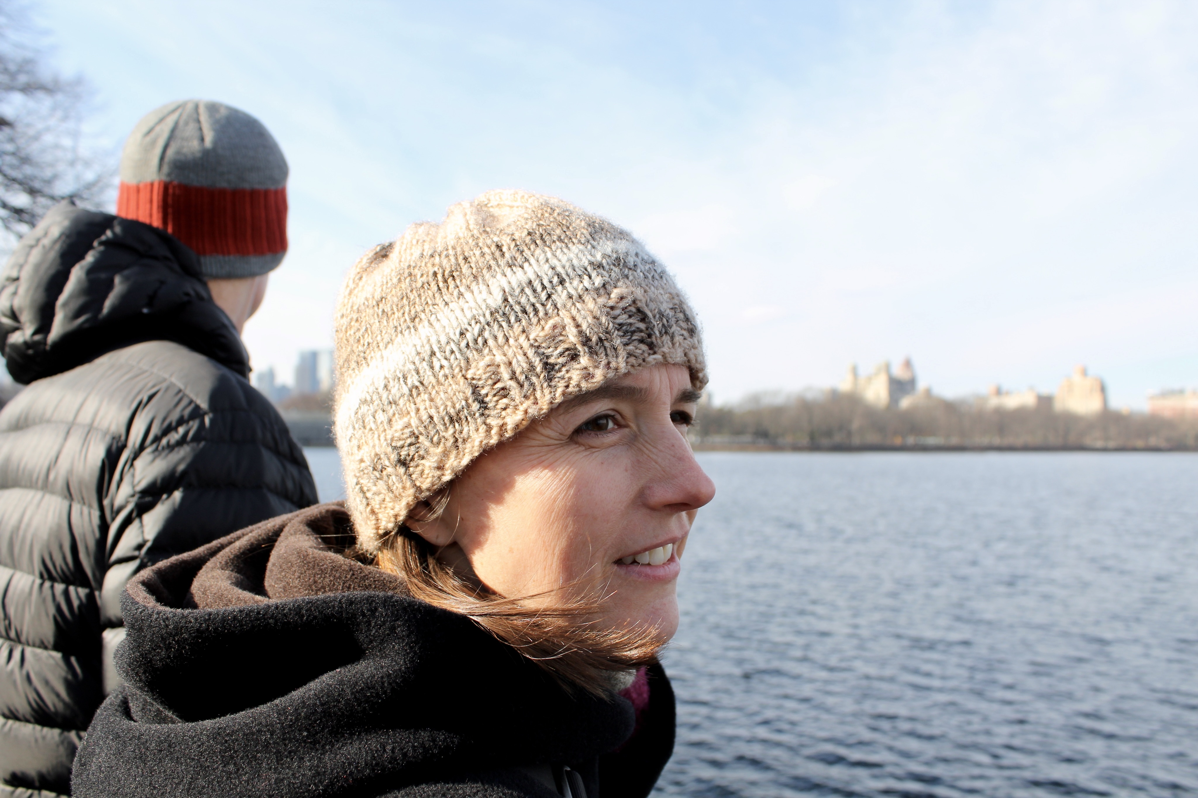 Woman with beige striped hat