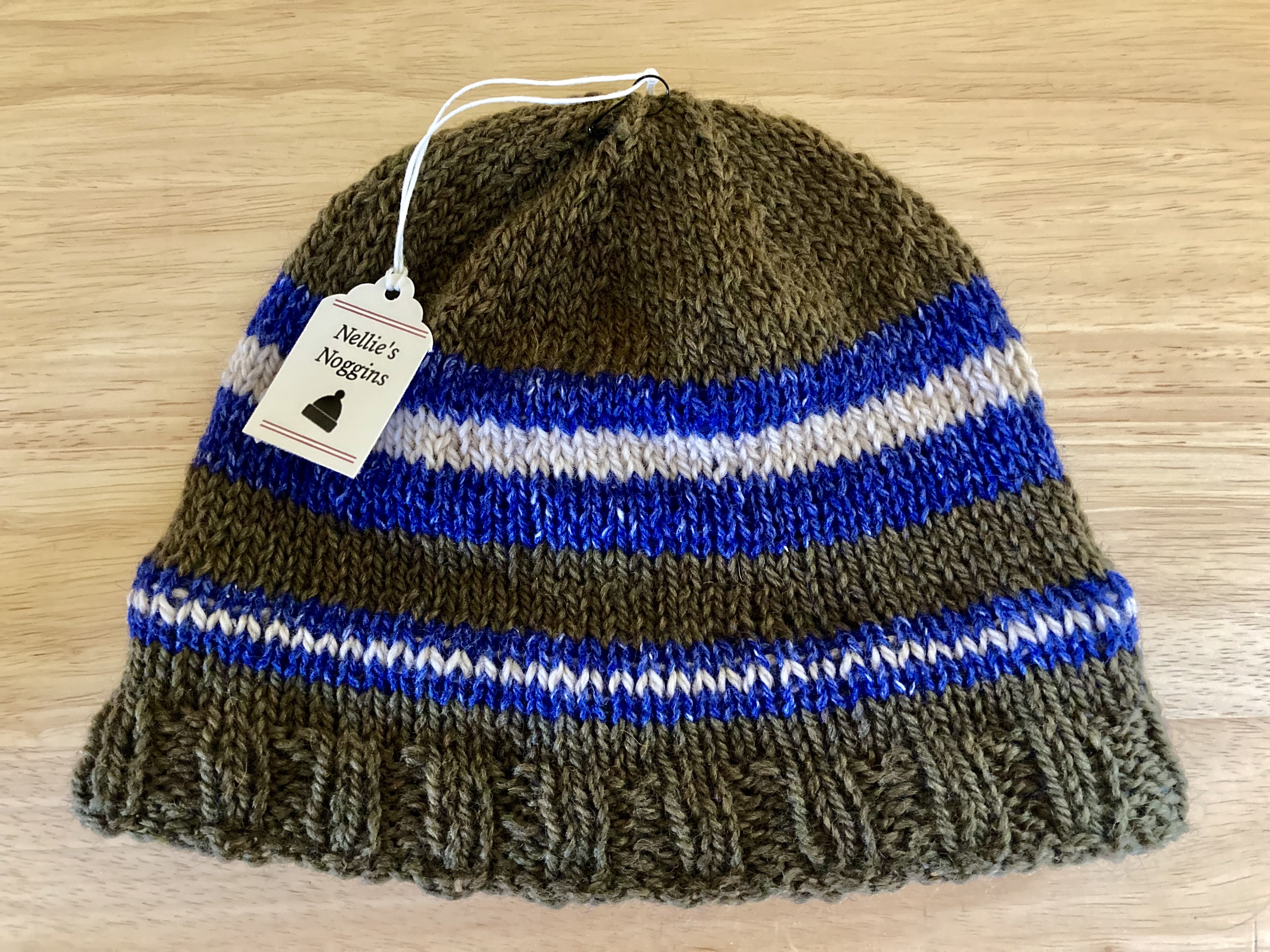 green, blue, and white striped knitted hat